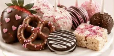 Strawberries, pretzels, cake pops and Rice Krispie treats